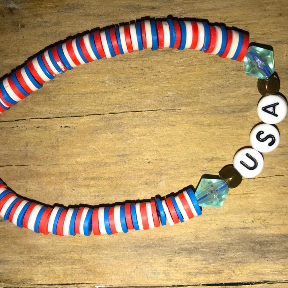 This is a USA red white and blue clay bead bracelet with a lobster clasp.